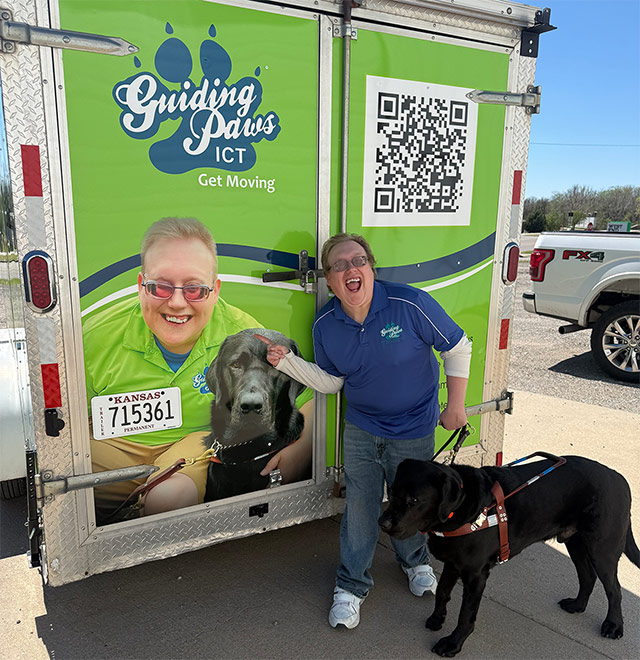 photo of Andrew Crane and his guide dog Jiminy at the Into the Light trailer